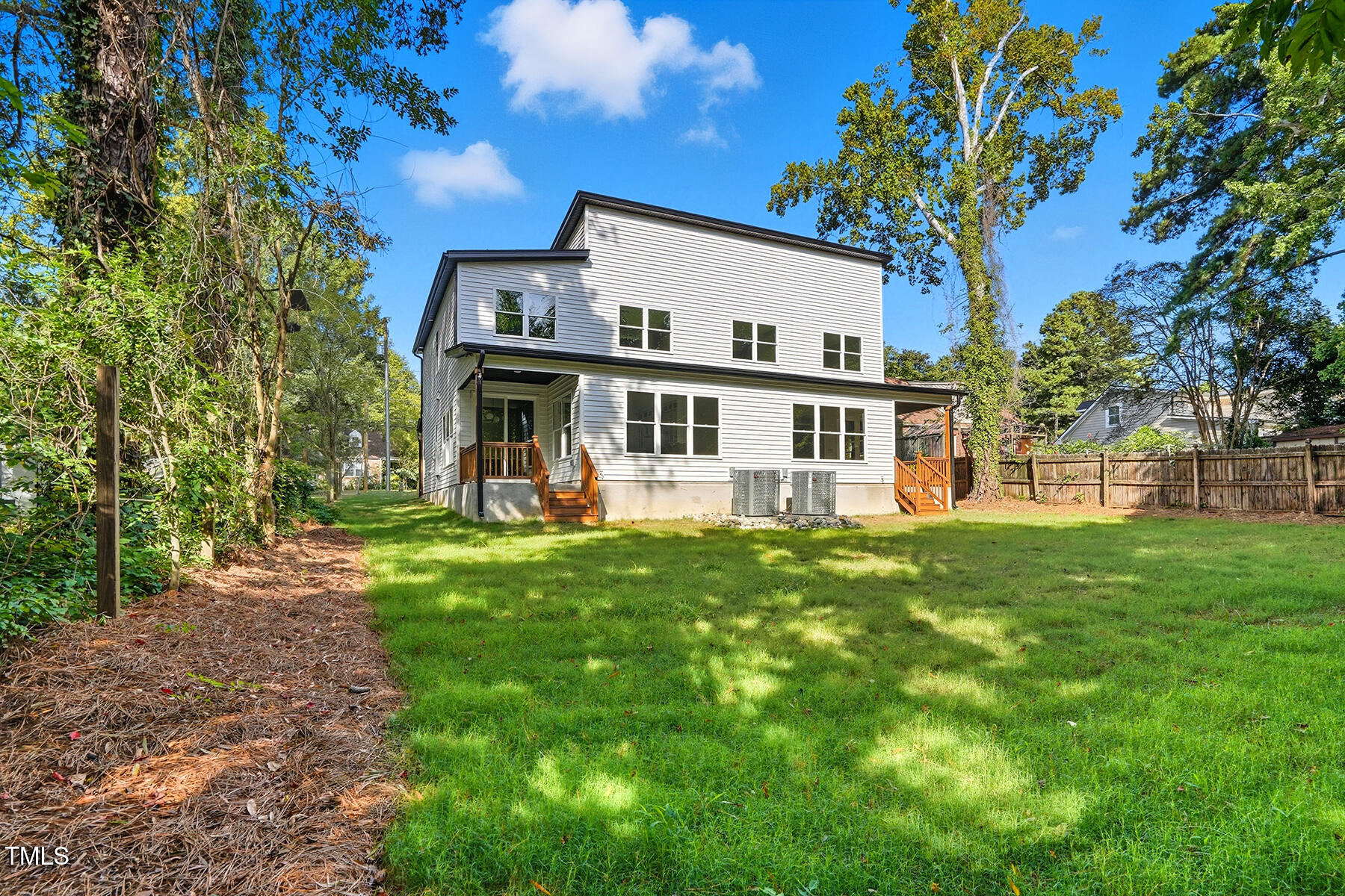 304 North King Charles Road, Unit 102 Raleigh, NC 27610 - Photo 28 of 30 a view of a house with a backyard