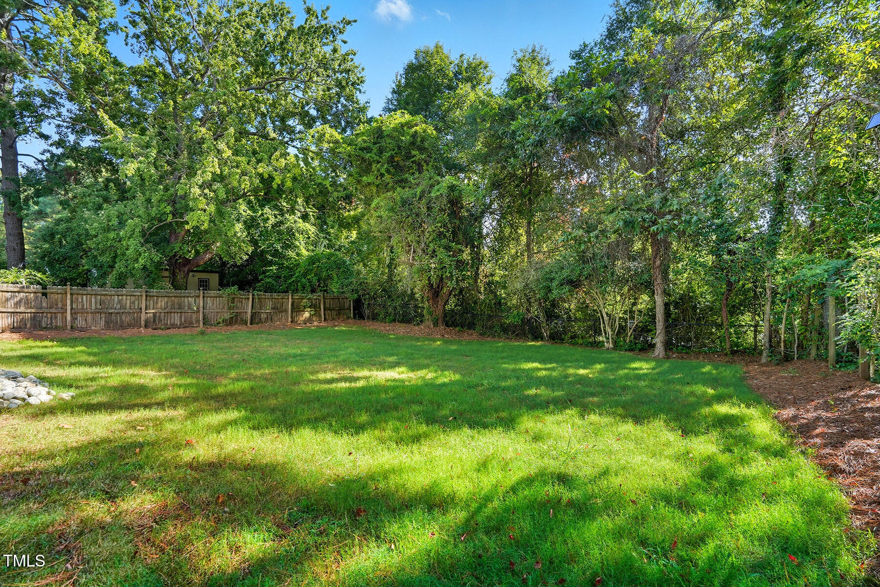 304 North King Charles Road, Unit 102 Raleigh, NC 27610 - Photo 29 of 30 a view of a backyard with a trees