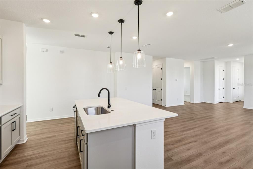 6673 Wake Street St. Cloud, FL 34771 - Photo 13 of 44 a bathroom with a sink a mirror and shower