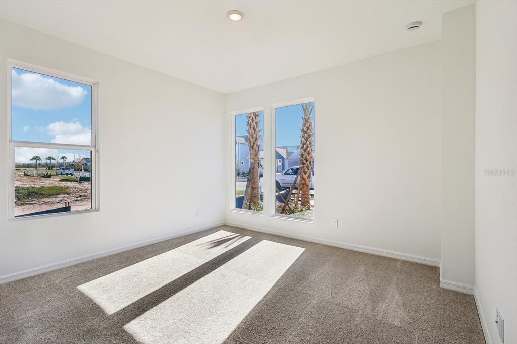 6673 Wake Street St. Cloud, FL 34771 - Photo 14 of 44 a view of a big room with window and furniture