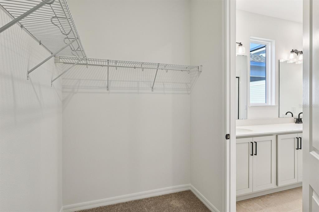 6673 Wake Street St. Cloud, FL 34771 - Photo 29 of 44 a view of a bathroom with white walls
