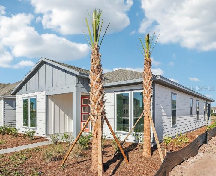 6673 Wake Street St. Cloud, FL 34771 - Photo 3 of 44 a front view of a house with a tree