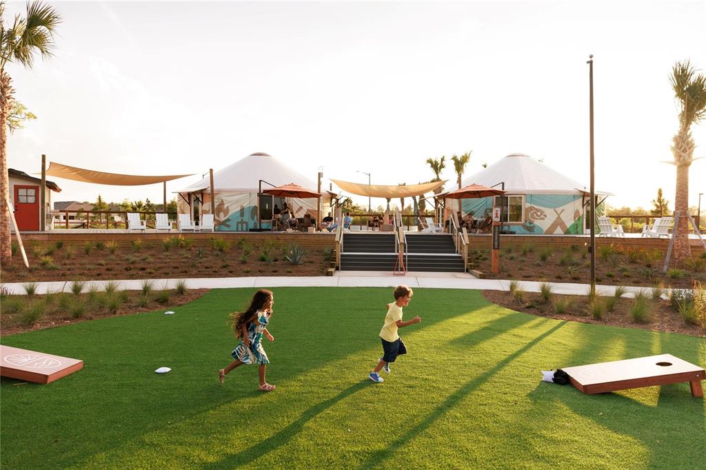 6673 Wake Street St. Cloud, FL 34771 - Photo 38 of 44 a view of a swimming pool with a lawn chairs