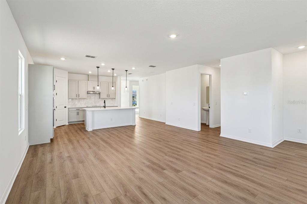 6673 Wake Street St. Cloud, FL 34771 - Photo 8 of 44 a view of kitchen with wooden floor