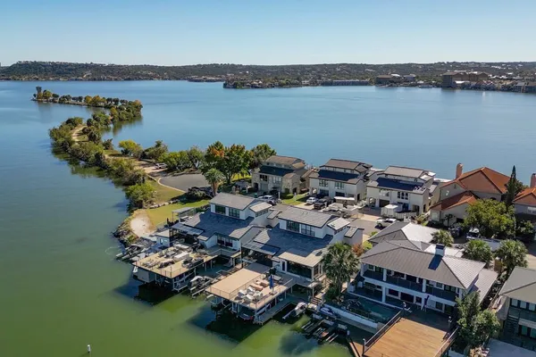 an aerial view of a house with lake view