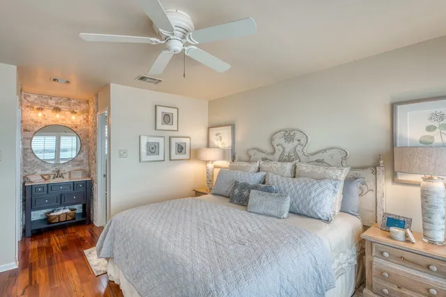 a bathroom with a sink a mirror a toilet and a shower