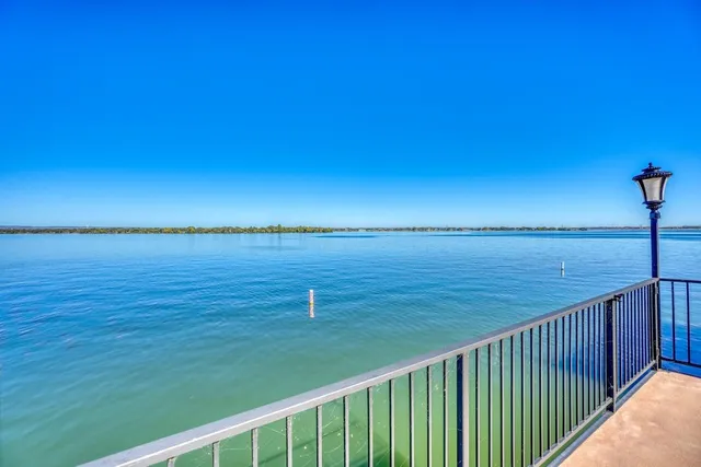 an aerial view of a house with a lake view
