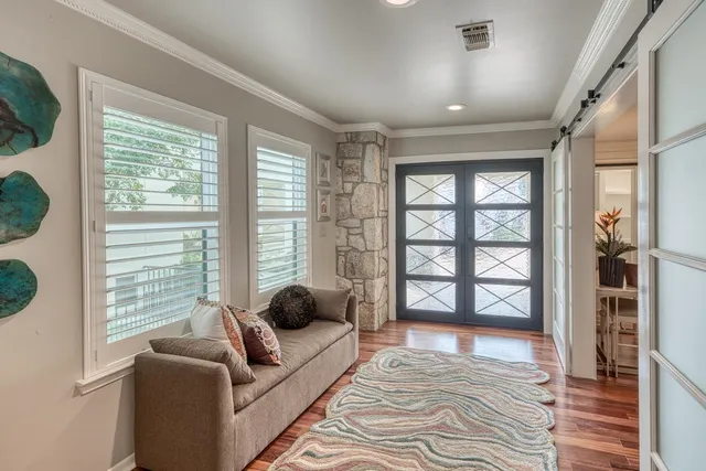 a bedroom with double bed and a window