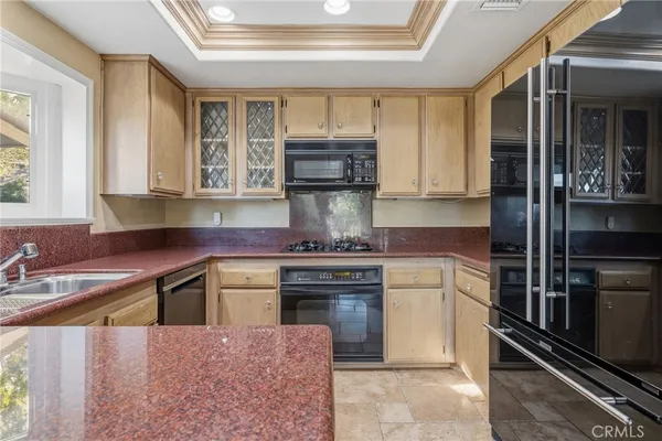 a kitchen with a stove and a sink