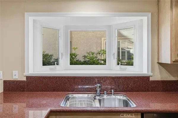a kitchen with a sink and a window