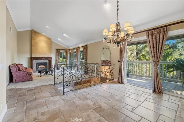 a very nice looking room with a large window and chandelier