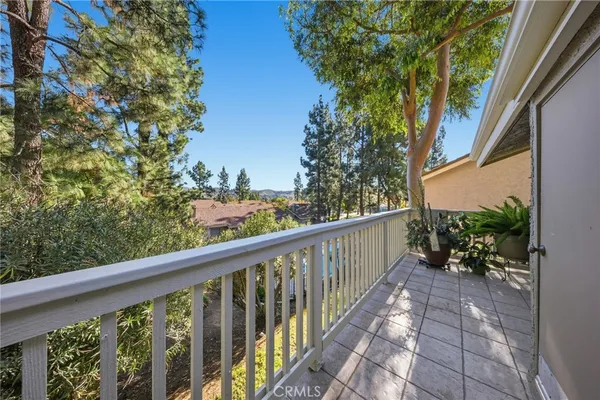a view of a balcony with wooden fence