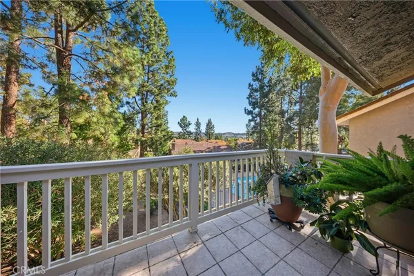 a view of a balcony with chairs