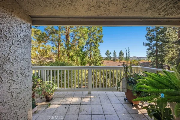 a view of a balcony with wooden floor