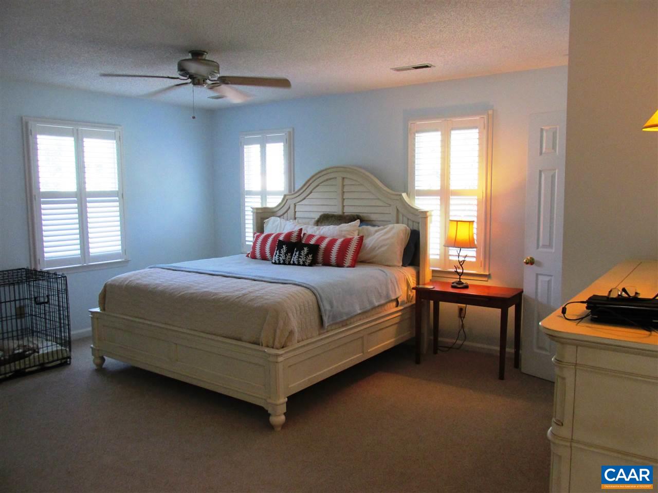 2704 Huntington Road Charlottesville, VA 22901 - Photo 19 of 42 a spacious bedroom with a bed and a window