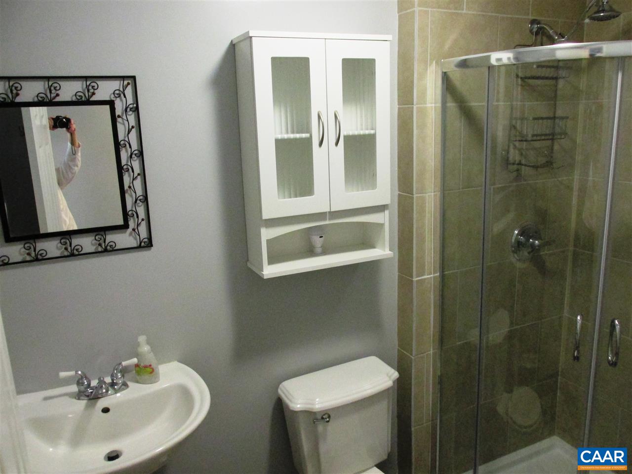 2704 Huntington Road Charlottesville, VA 22901 - Photo 28 of 42 a bathroom with a toilet sink and mirror