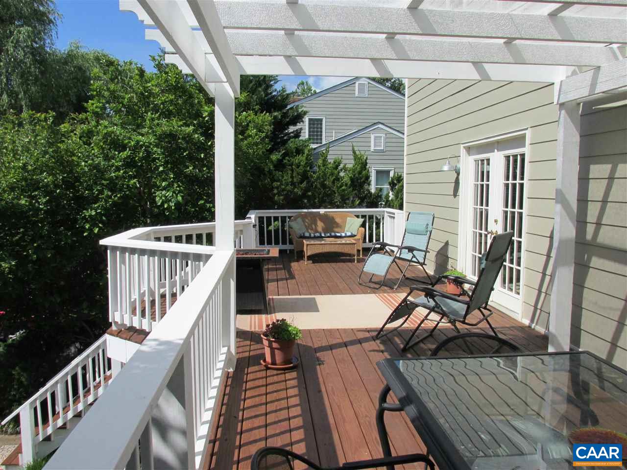 2704 Huntington Road Charlottesville, VA 22901 - Photo 31 of 42 a view of a patio with couches table and chairs and wooden floor