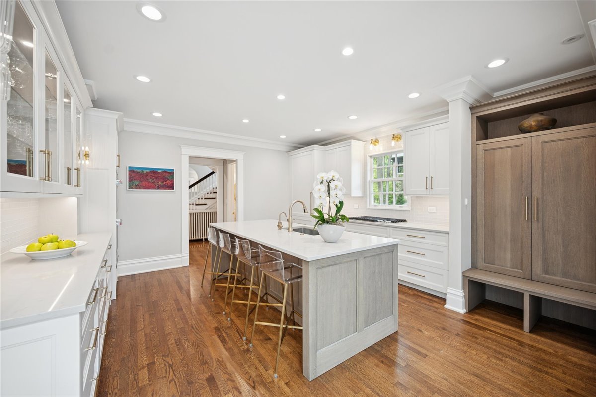 755 Lincoln Avenue Winnetka, IL 60093 - Photo 13 of 52 a kitchen with stainless steel appliances granite countertop a refrigerator a stove and a wooden floors