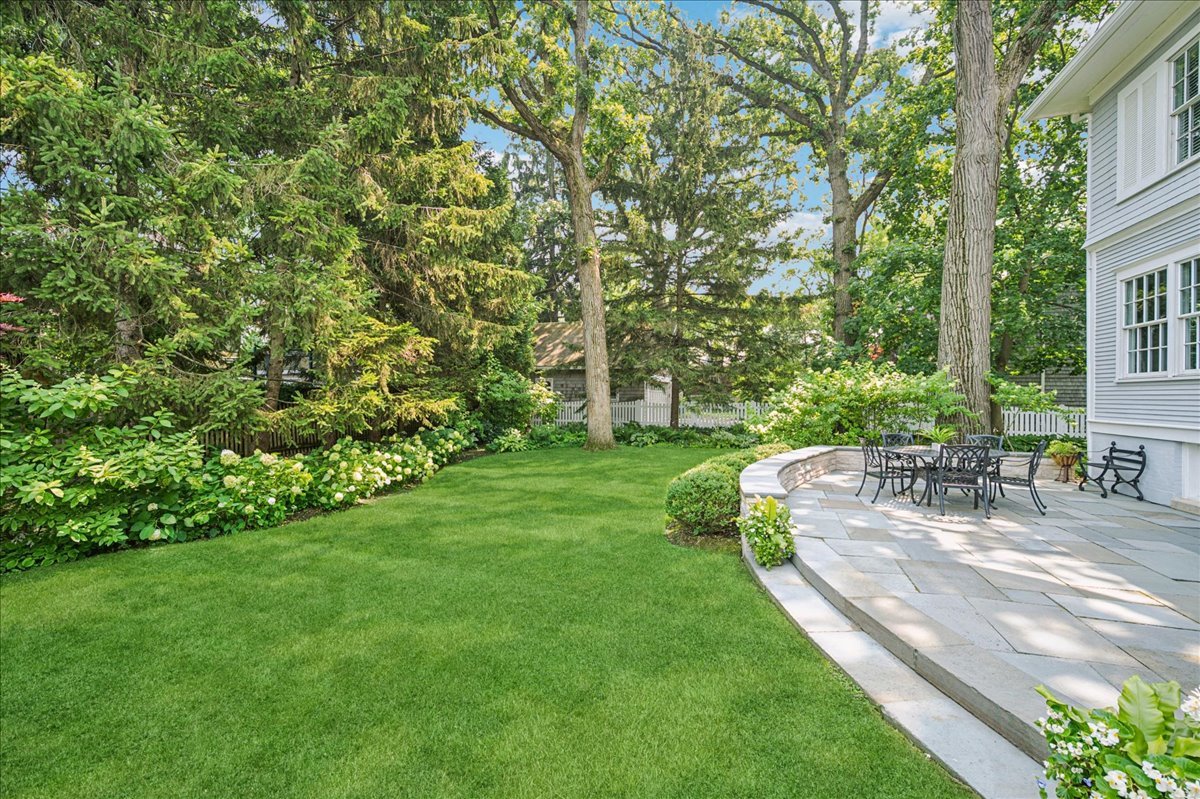 755 Lincoln Avenue Winnetka, IL 60093 - Photo 28 of 52 a view of a backyard with sitting area