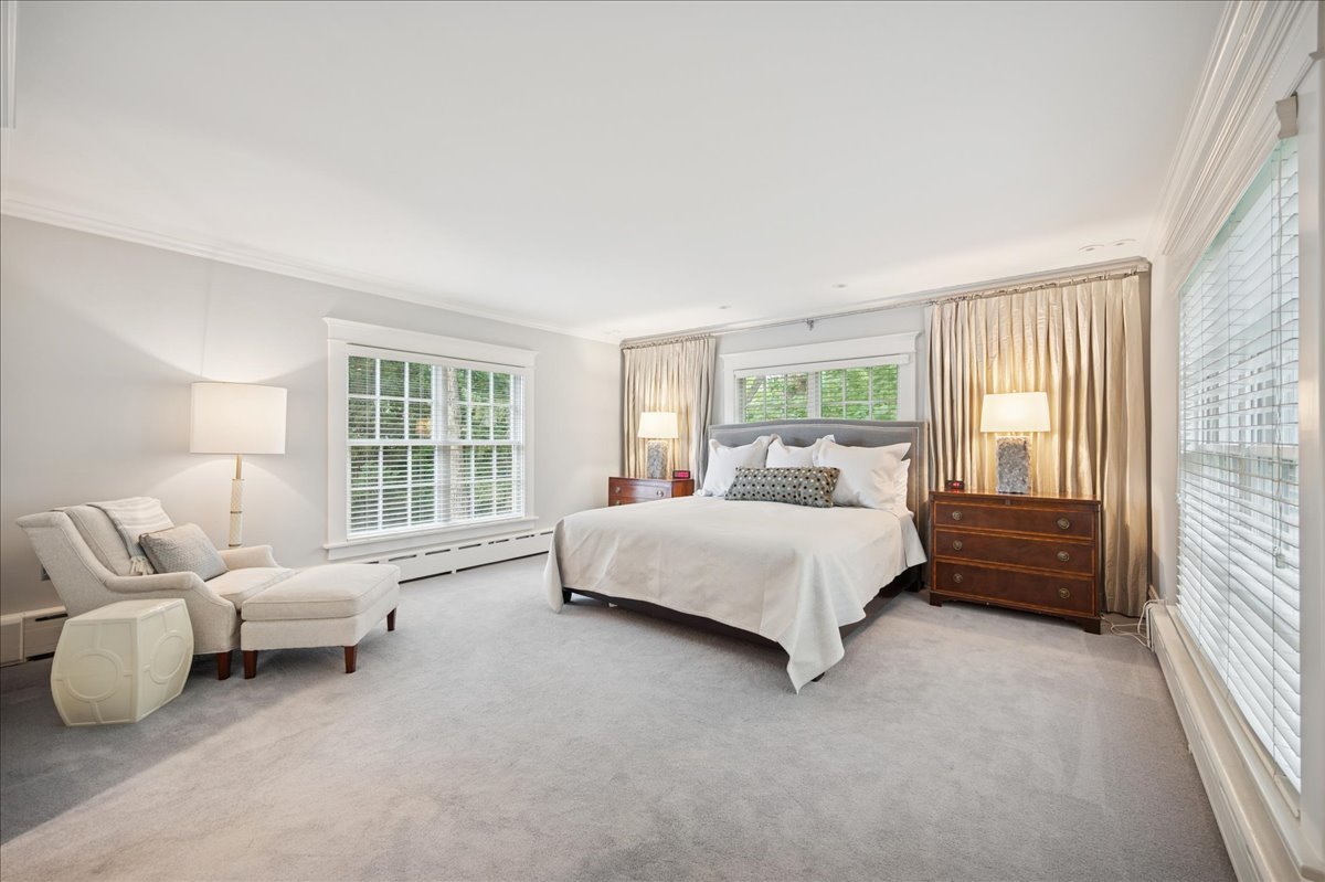 755 Lincoln Avenue Winnetka, IL 60093 - Photo 31 of 52 a spacious bedroom with a bed and glass window