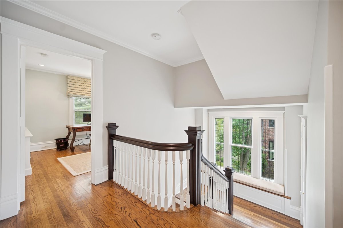 755 Lincoln Avenue Winnetka, IL 60093 - Photo 37 of 52 a view of a hallway with wooden floor and staircase