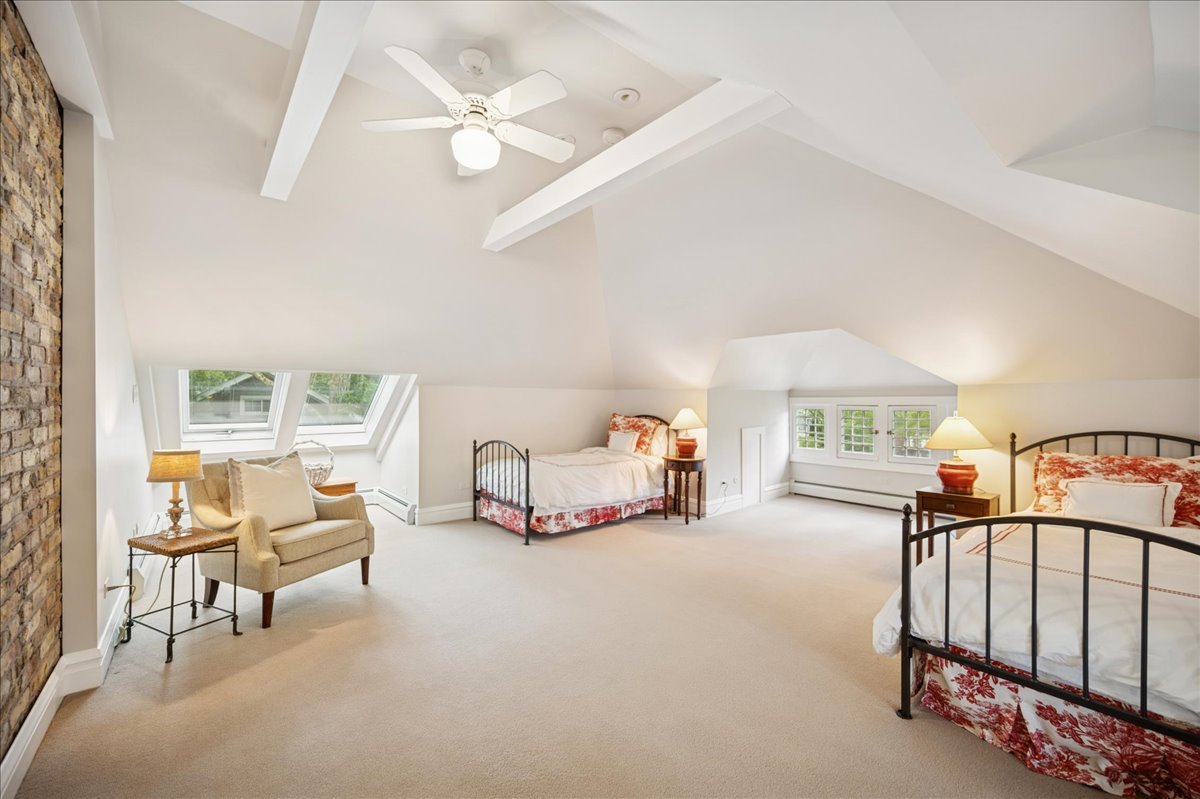755 Lincoln Avenue Winnetka, IL 60093 - Photo 38 of 52 a bedroom with furniture and a large window