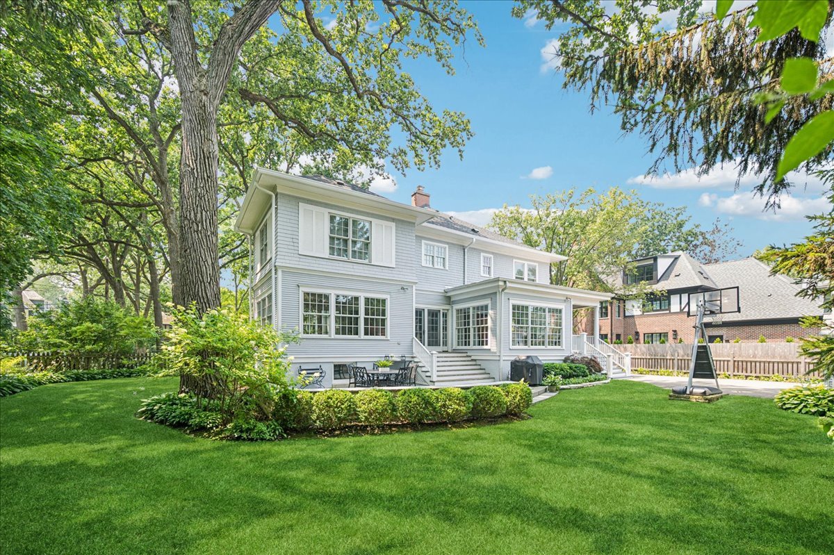 755 Lincoln Avenue Winnetka, IL 60093 - Photo 43 of 52 a front view of a house with a yard and trees