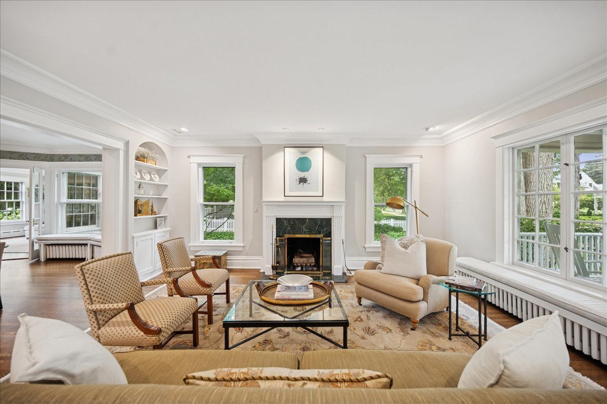 755 Lincoln Avenue Winnetka, IL 60093 - Photo 7 of 52 a living room with furniture fireplace and a large window