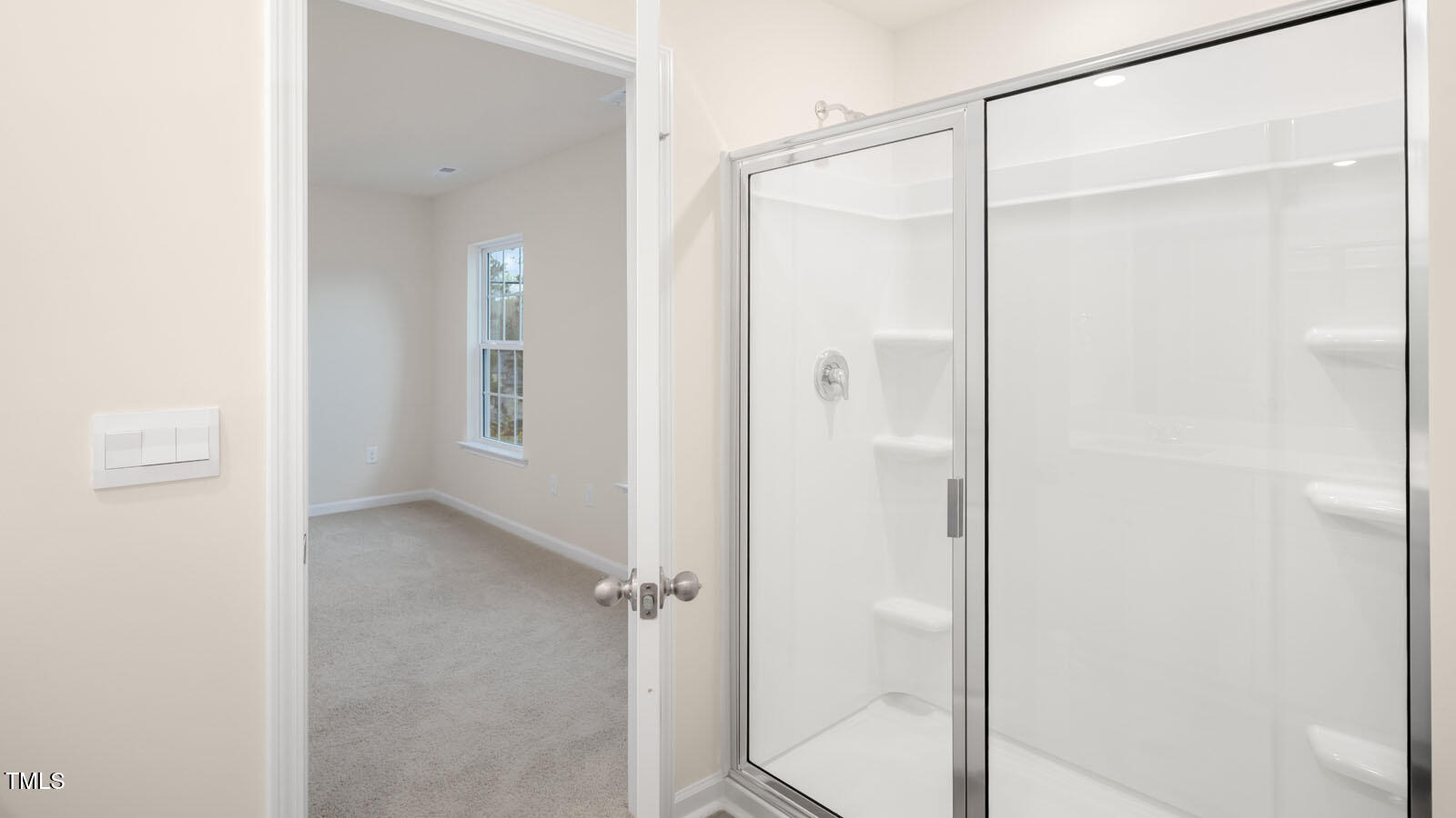 6025 Sodium Street Raleigh, NC 27610 - Photo 19 of 24 a bathroom with a glass shower door