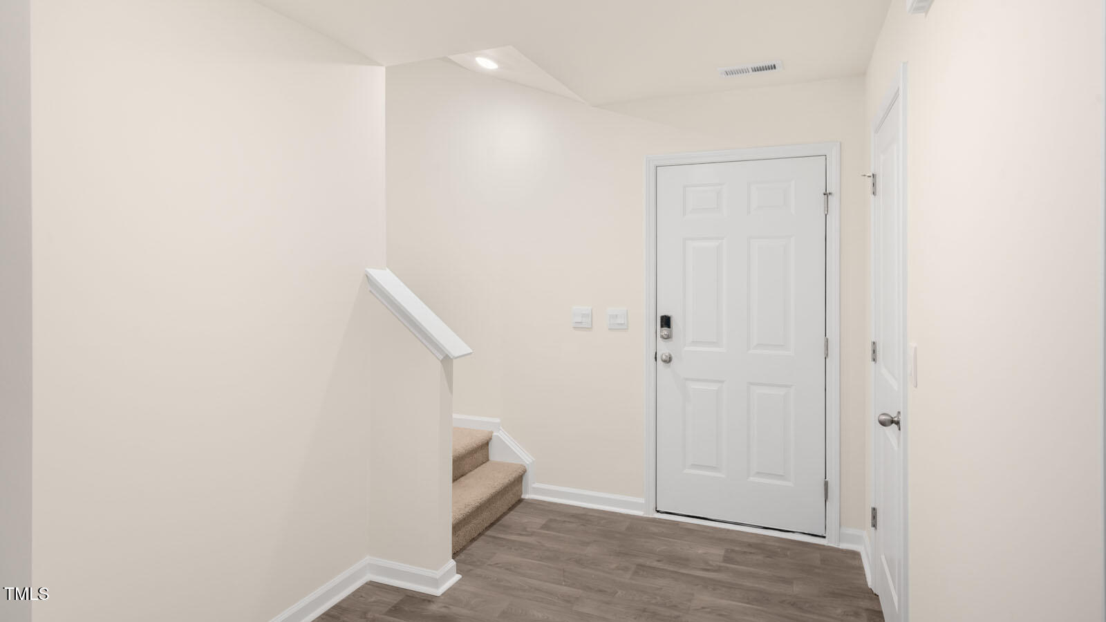 6025 Sodium Street Raleigh, NC 27610 - Photo 2 of 24 a view of an empty room with wooden floor