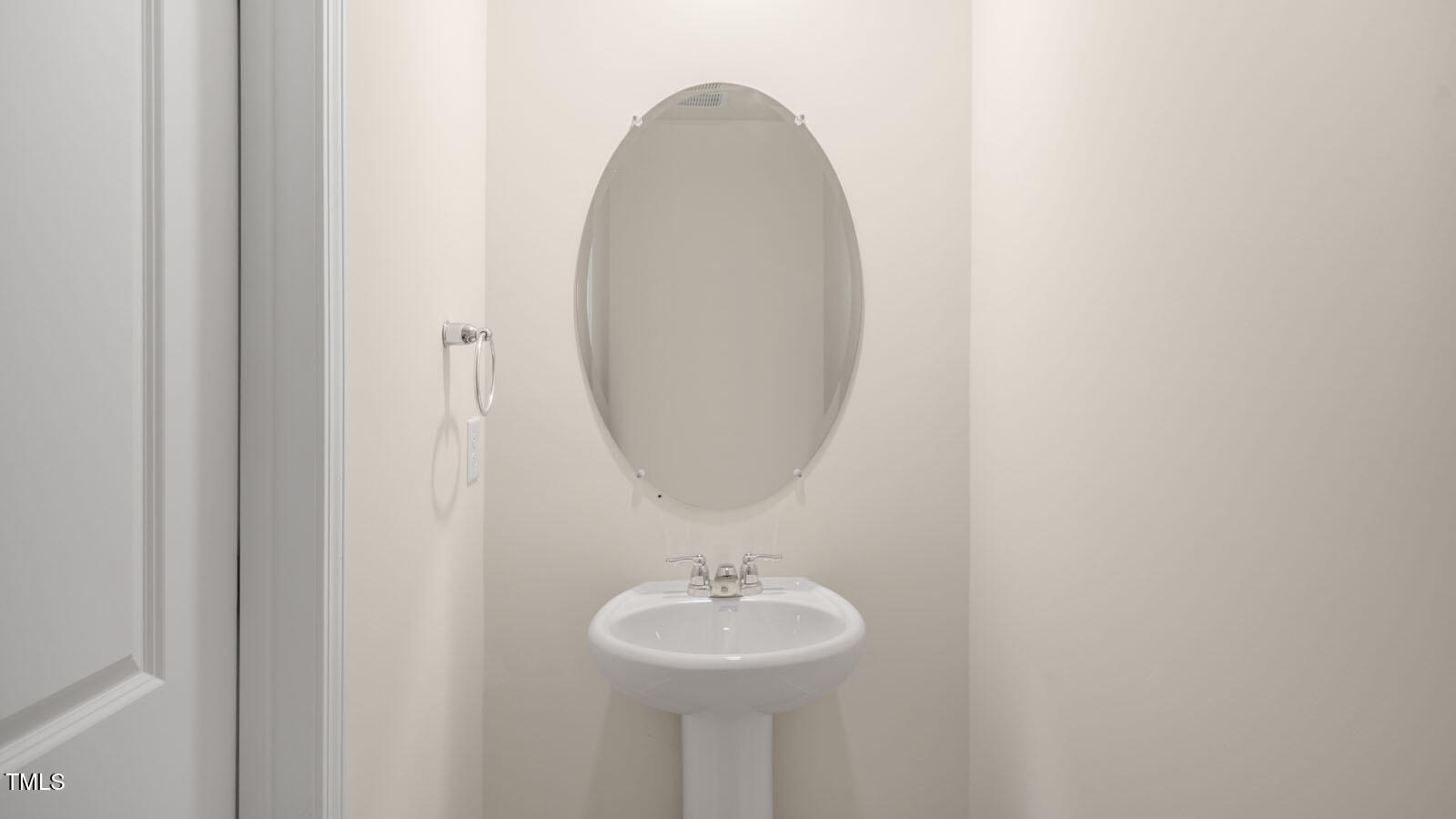 6025 Sodium Street Raleigh, NC 27610 - Photo 6 of 24 a bathroom with a sink and a mirror