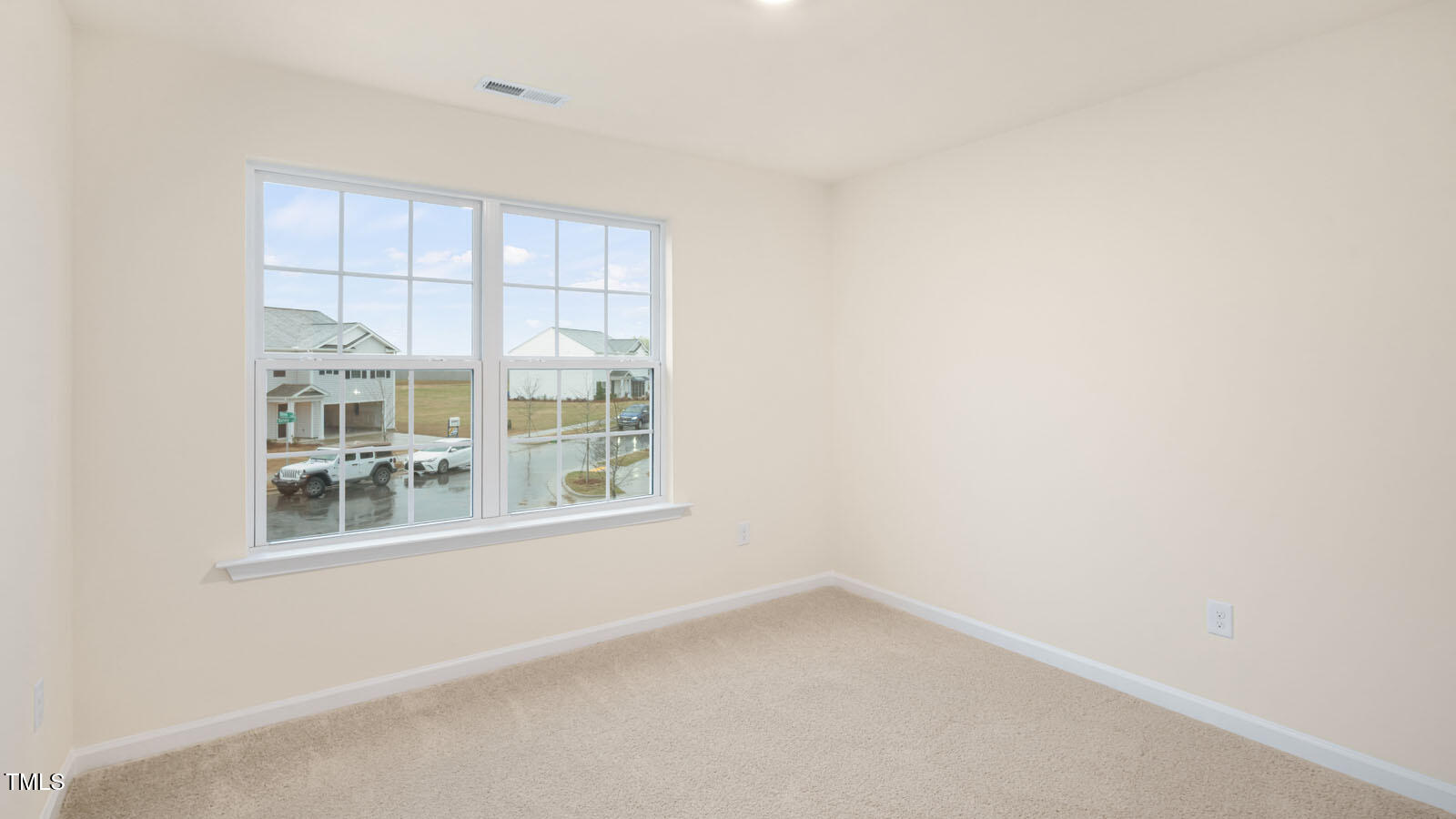 6025 Sodium Street Raleigh, NC 27610 - Photo 8 of 24 a view of an empty room with a window