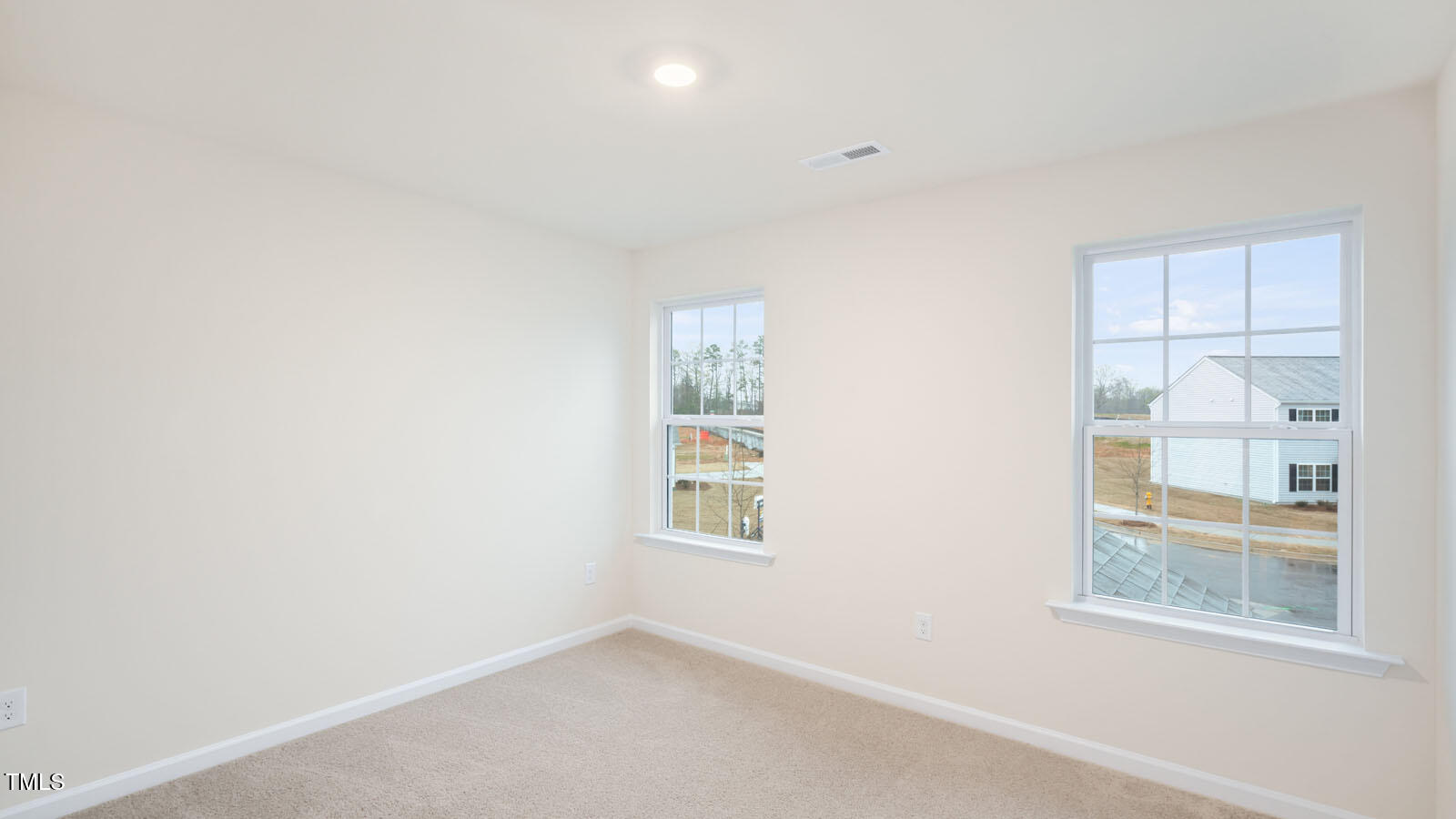 6025 Sodium Street Raleigh, NC 27610 - Photo 9 of 24 an empty room with windows