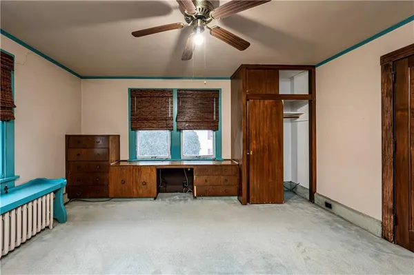 a bed room with furniture and window