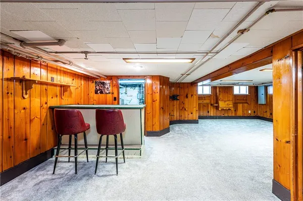 a view of an chairs and table in a room