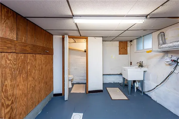 a bathroom with a sink and mirror