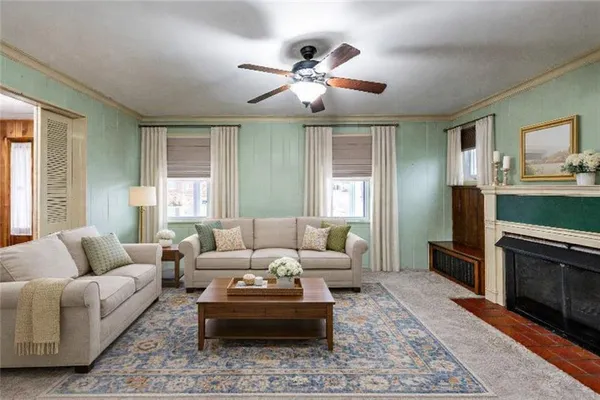 a living room with furniture and a fireplace