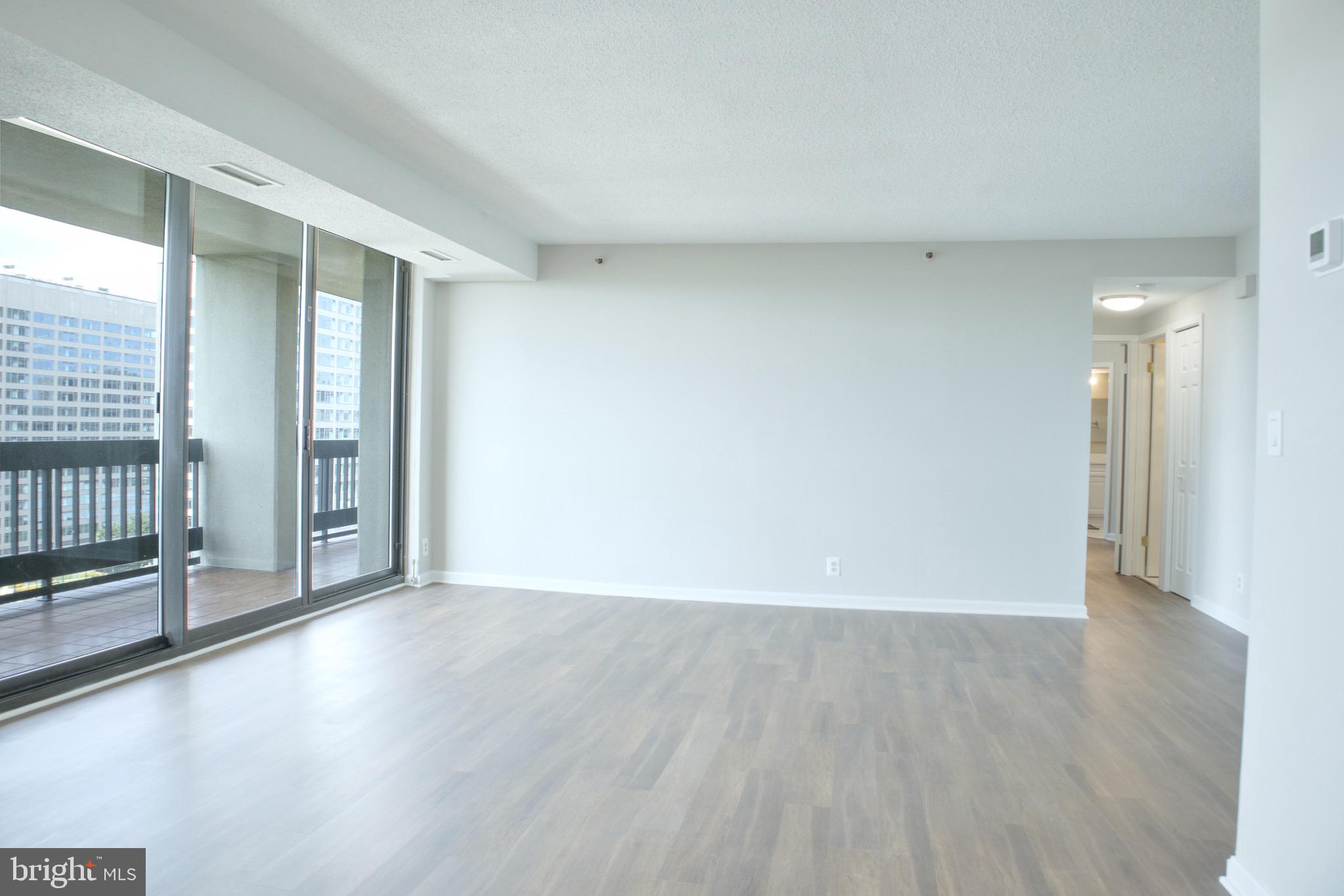 5505 Seminary Road, Unit 1210N Falls Church, VA 22041 - Photo 10 of 38 a view of an empty room with glass door