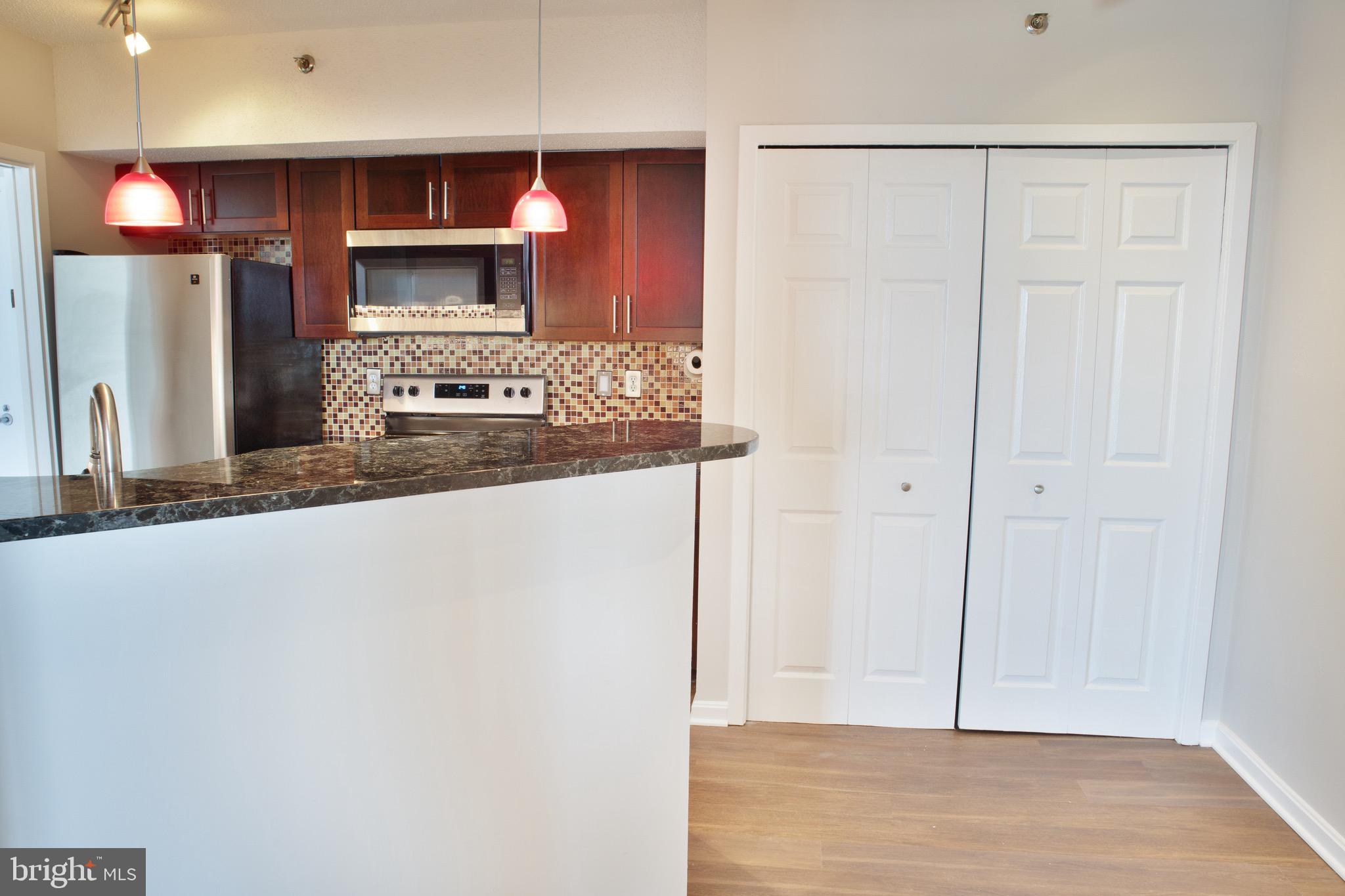 5505 Seminary Road, Unit 1210N Falls Church, VA 22041 - Photo 18 of 38 a kitchen with stainless steel appliances a refrigerator and a stove