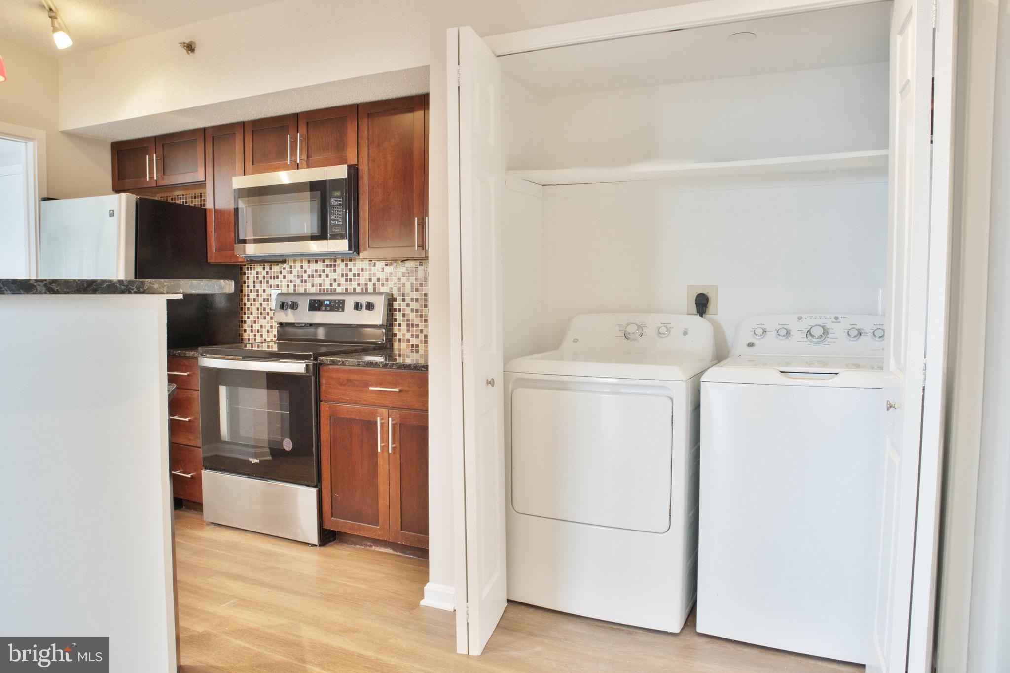 5505 Seminary Road, Unit 1210N Falls Church, VA 22041 - Photo 19 of 38 a kitchen with a refrigerator sink and stove top oven