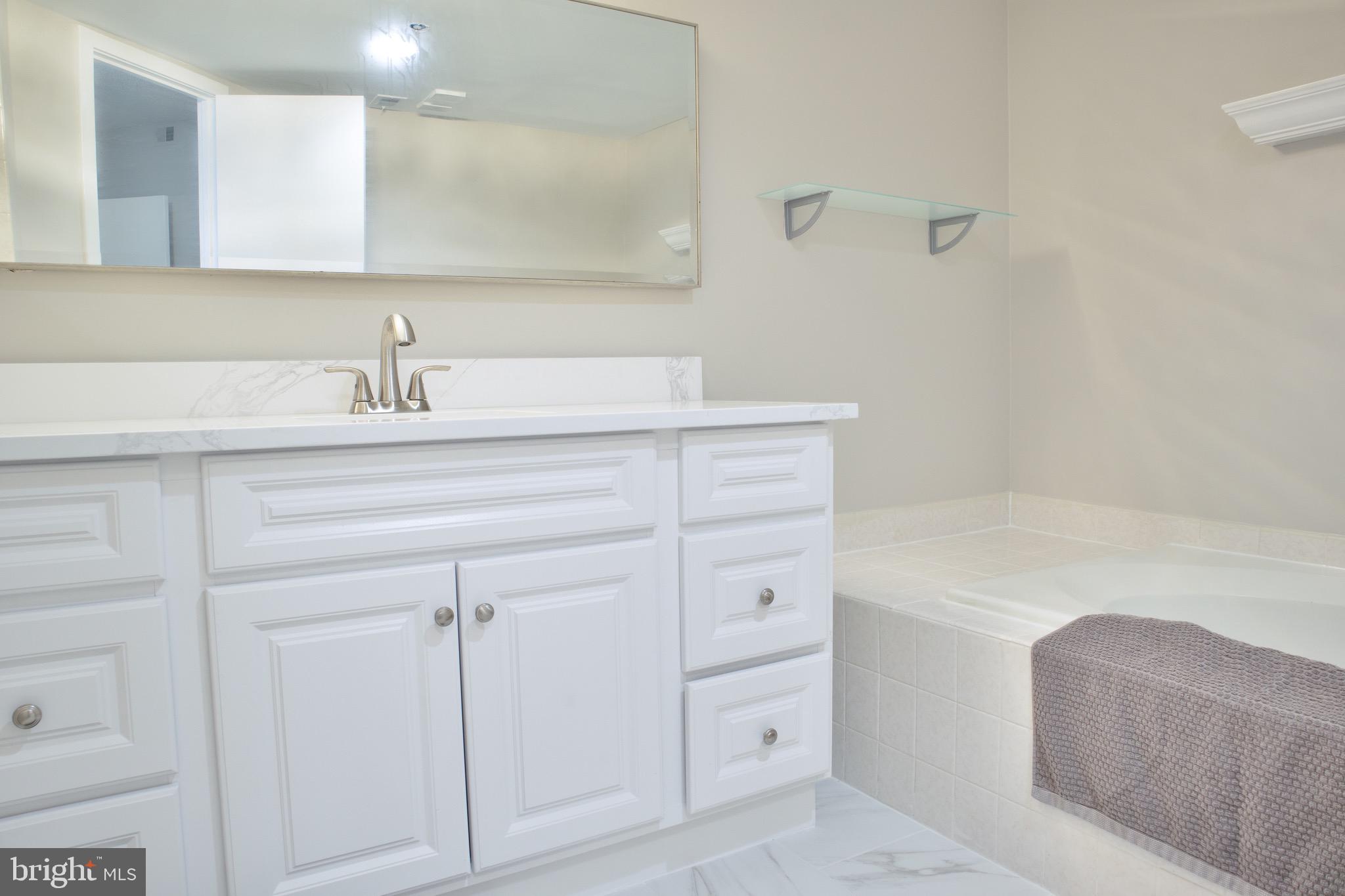 5505 Seminary Road, Unit 1210N Falls Church, VA 22041 - Photo 25 of 38 a bathroom with a sink and a mirror