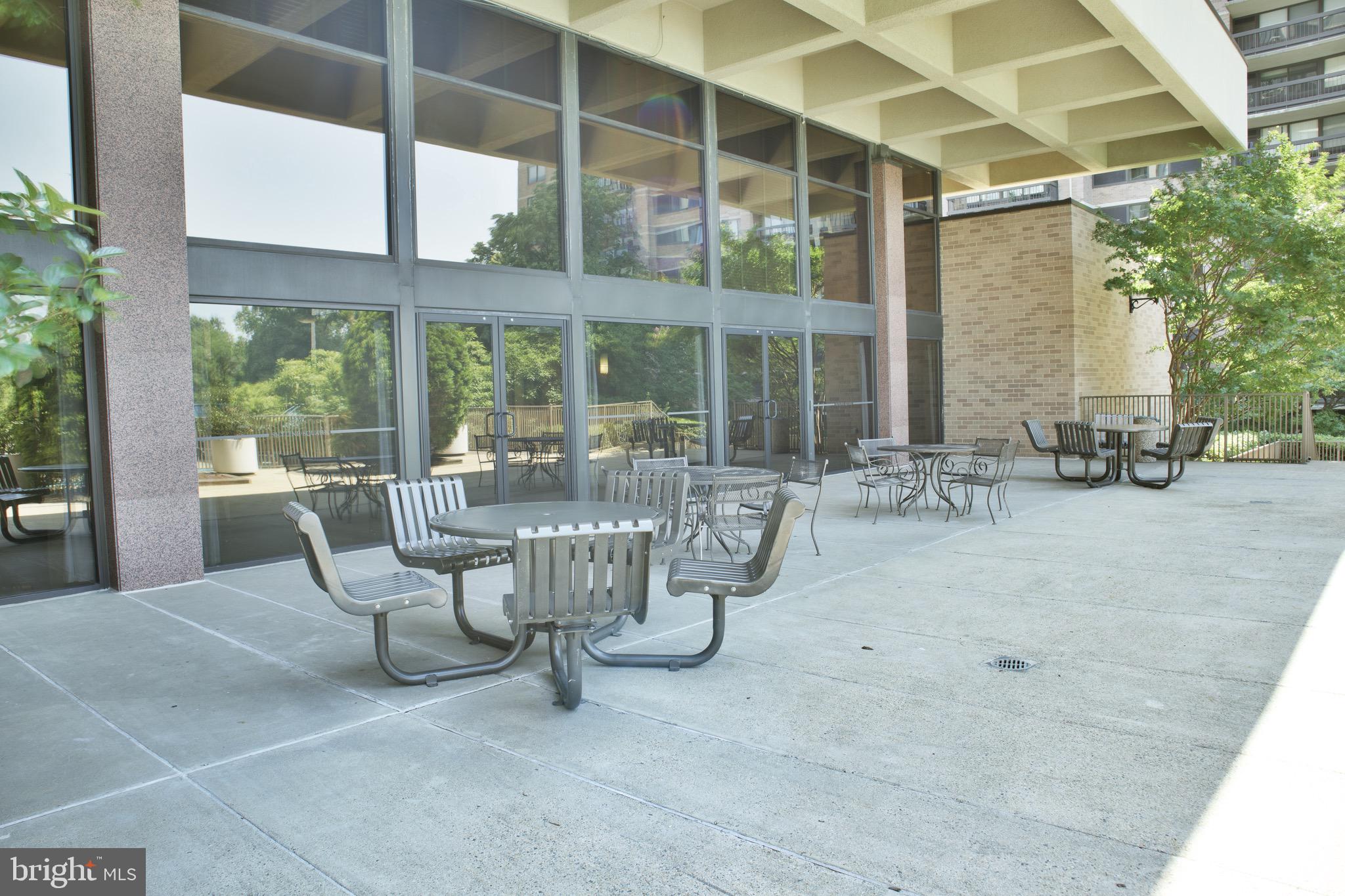 5505 Seminary Road, Unit 1210N Falls Church, VA 22041 - Photo 33 of 38 a view of a patio with table and chairs and potted plants