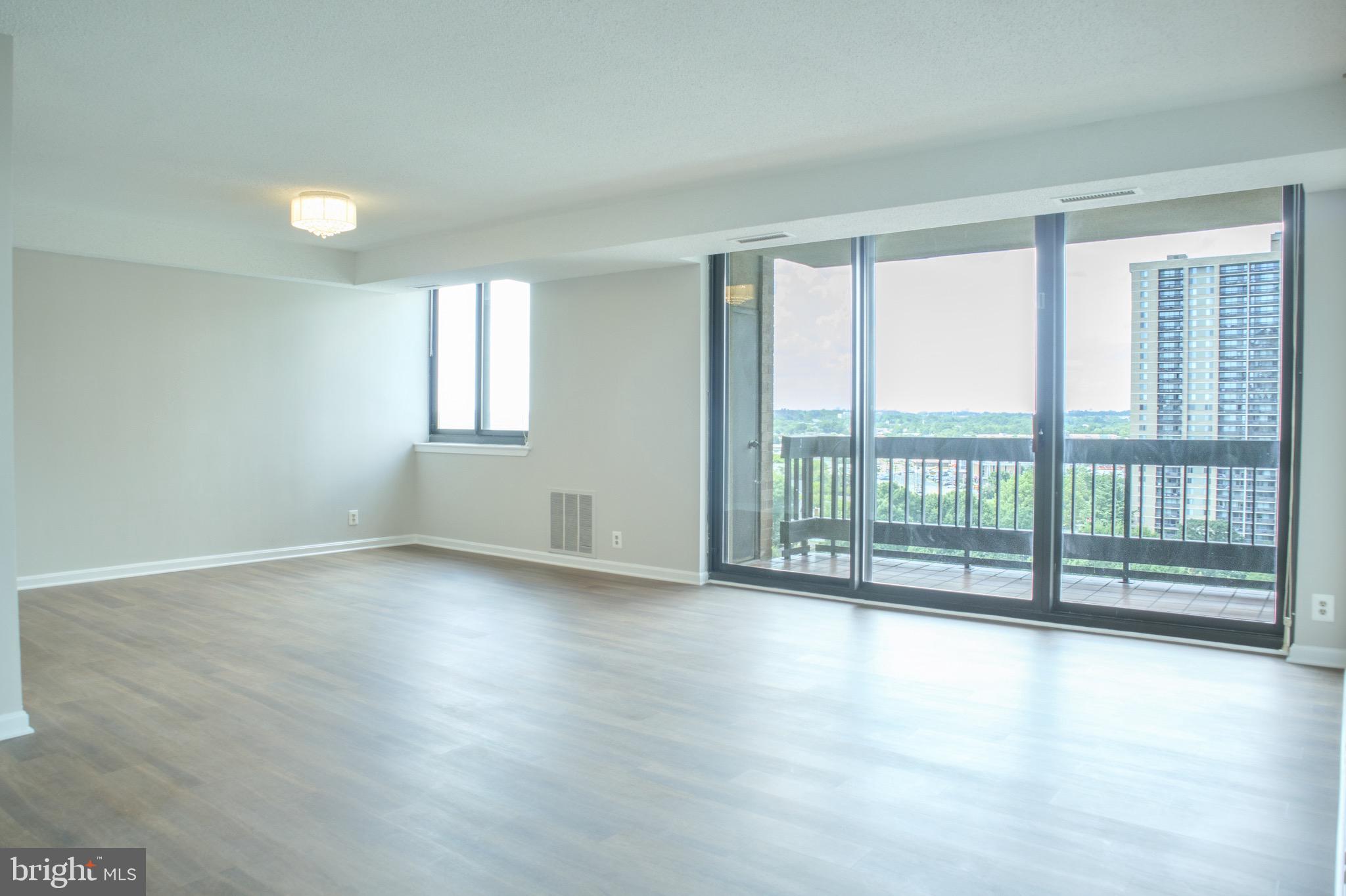 5505 Seminary Road, Unit 1210N Falls Church, VA 22041 - Photo 9 of 38 wooden floor in an empty room with a window