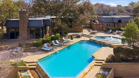 a view of a patio with swimming pool
