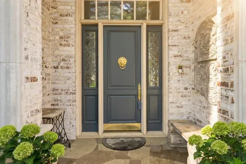 a front view of a building with a potted plant