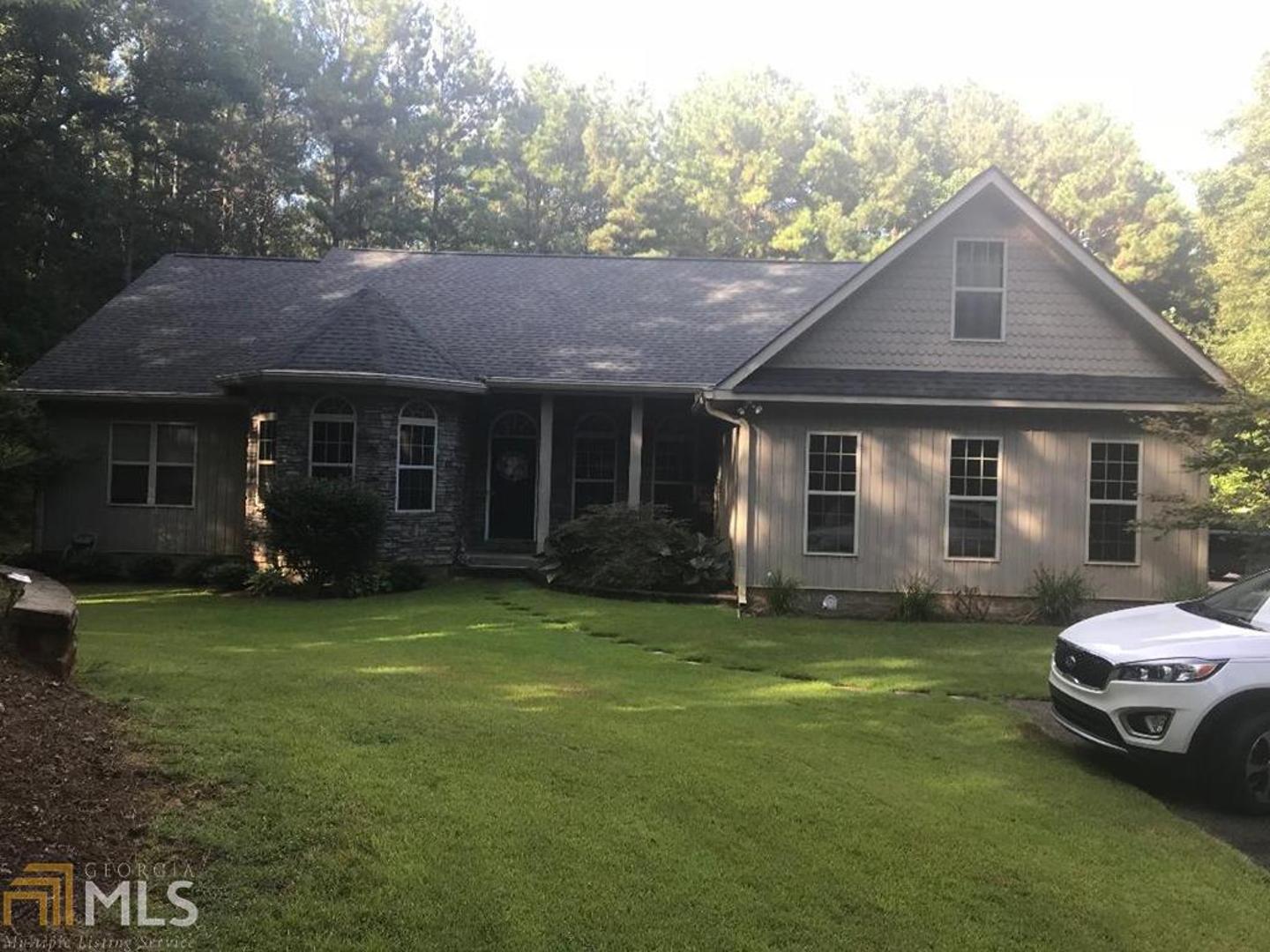 324-r C R C Jones Road Franklin, GA 30217 - Photo 1 of 1 a front view of a house with a garden