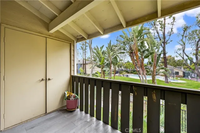 a view of a porch with wooden floor
