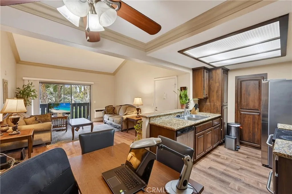 3535 Banbury Drive, Unit 94 Riverside, CA 92503 - Photo 10 of 21 a living room with furniture a chandelier and a table