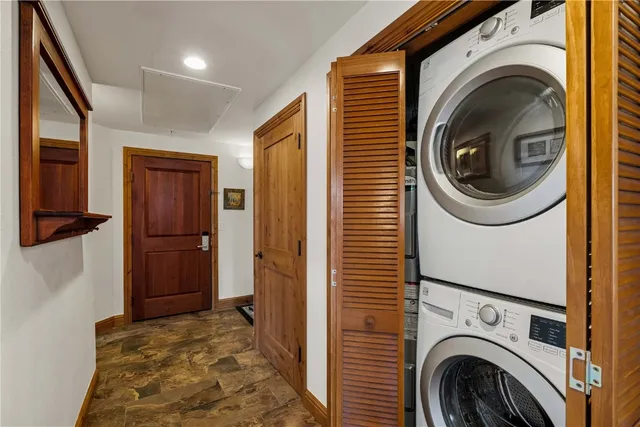 a view of a hallway with washer and dryer
