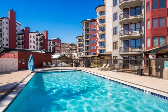 a view of a swimming pool with a lounge chairs